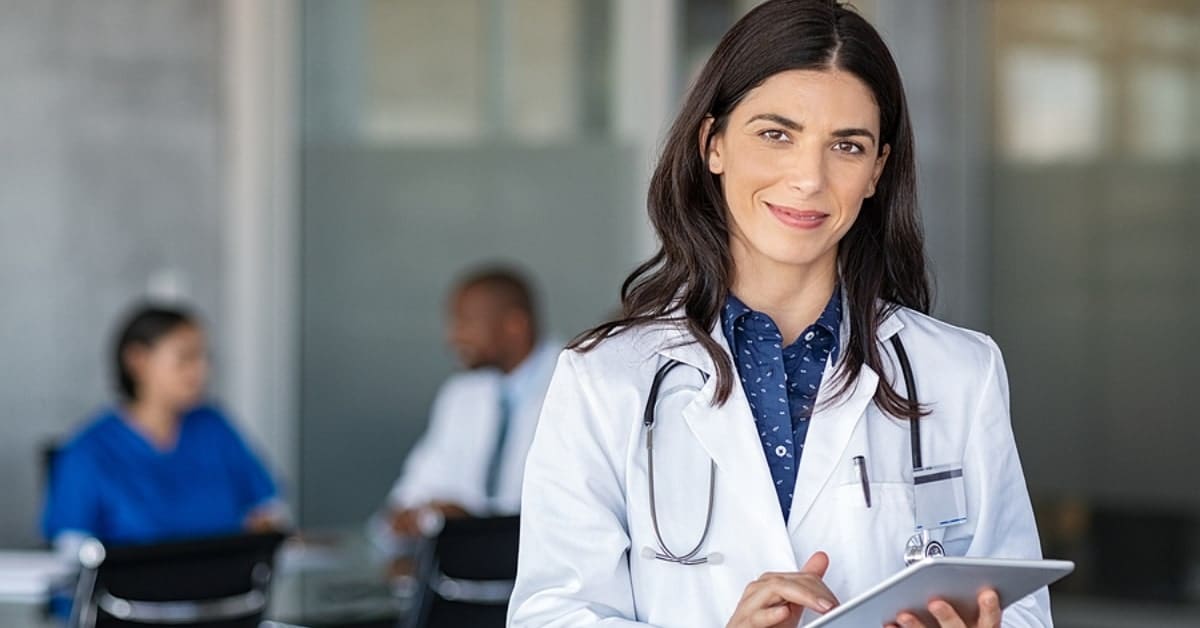 Female Physician Holding Tablet