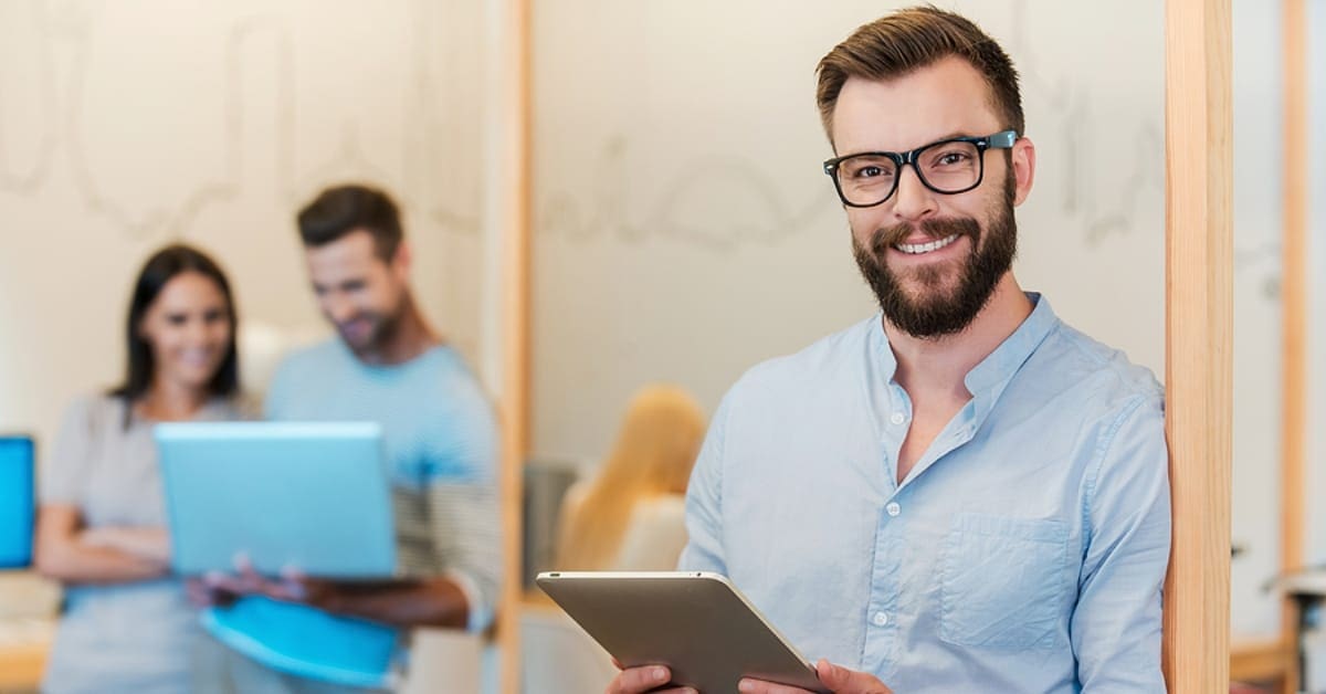 Man on Tablet Smiling for Camera