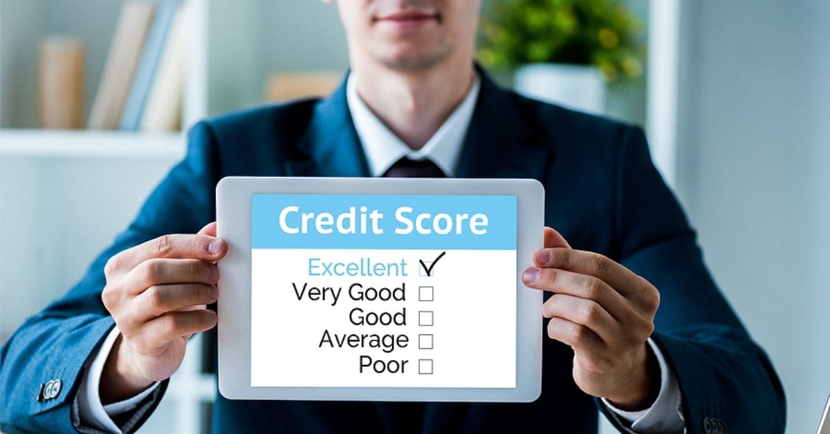 Man Holding Tablet Showing Excellent Credit Score