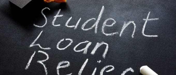 chalkboard with student loan relief written