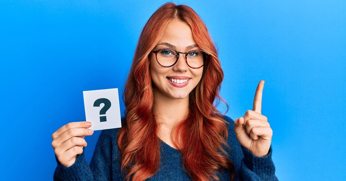 Woman Holding Question Mark and One Finger up