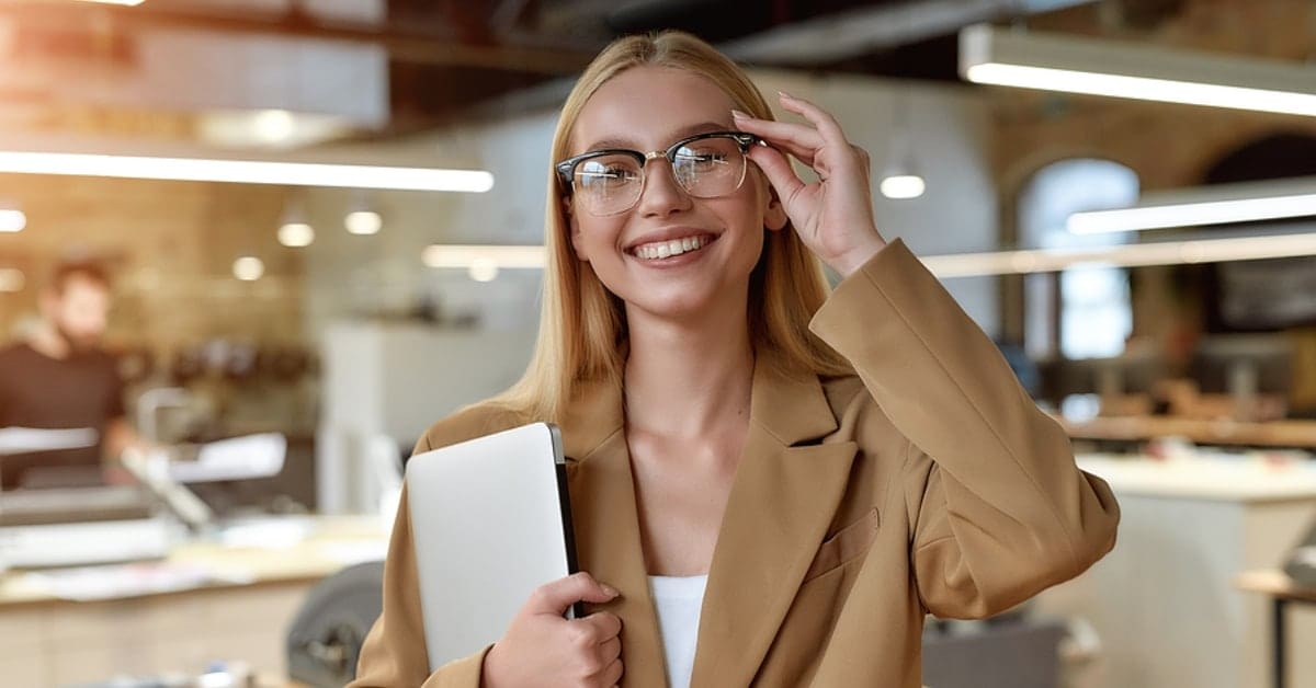 Blonde Business Professional with Glasses Smiling for Camera