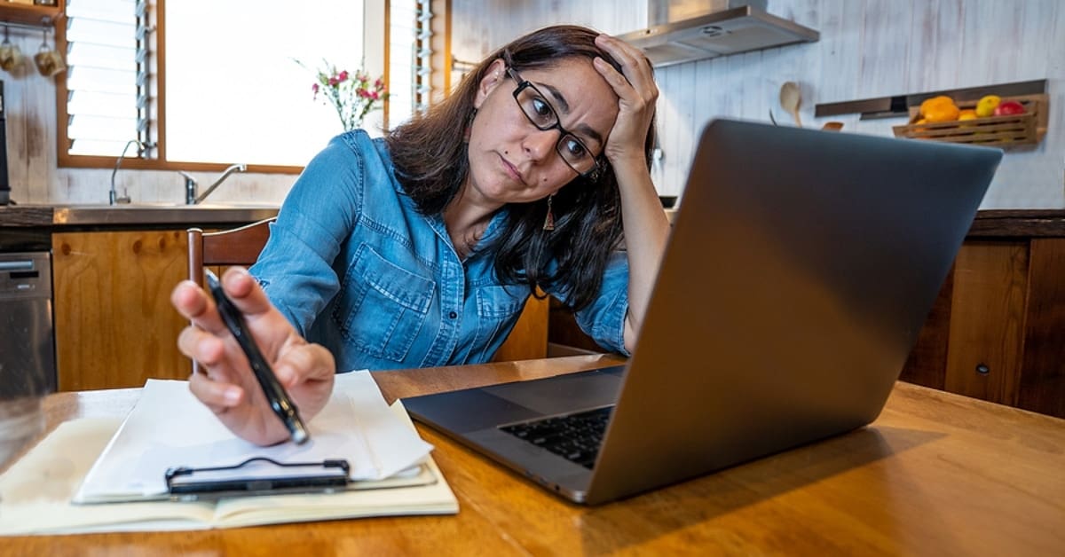Woman Looking Stressed Looking at Laptop