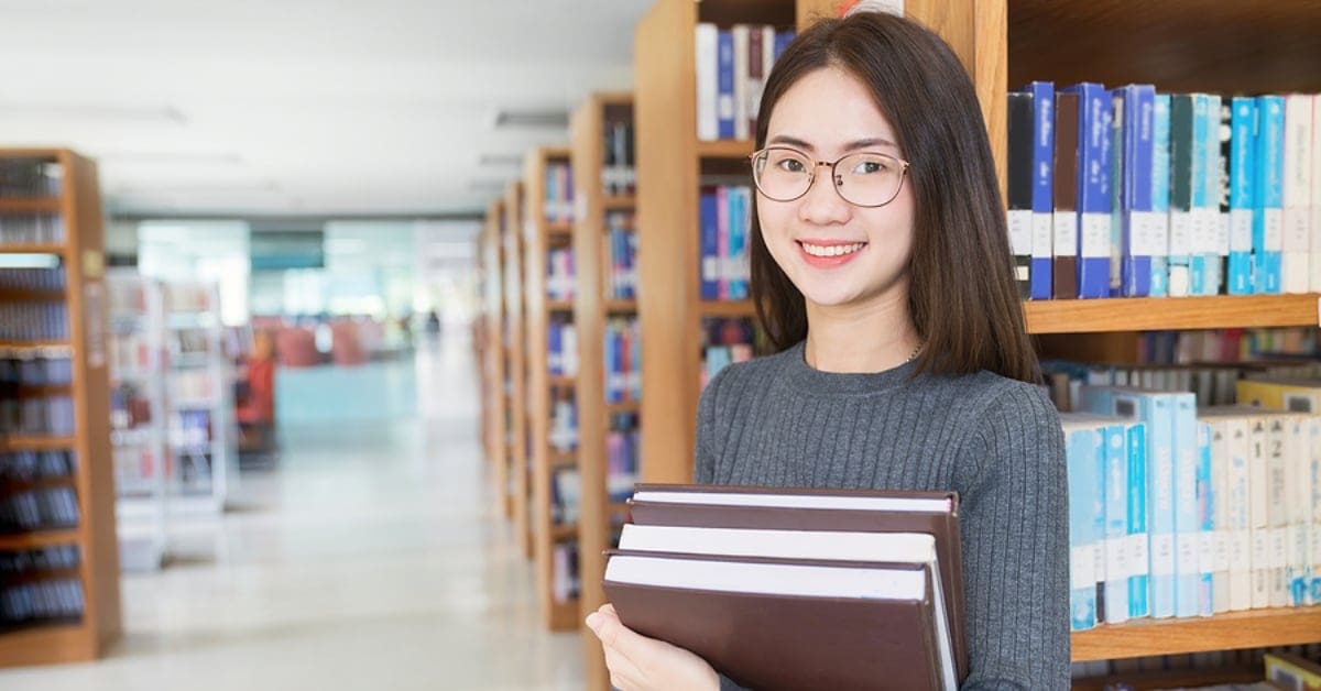 young female in library