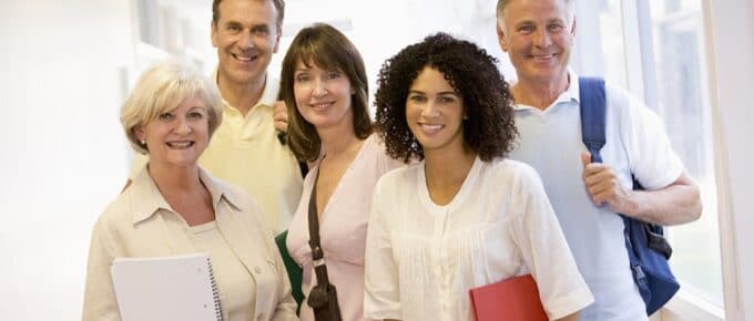 Group of People Posing for Picture in Building
