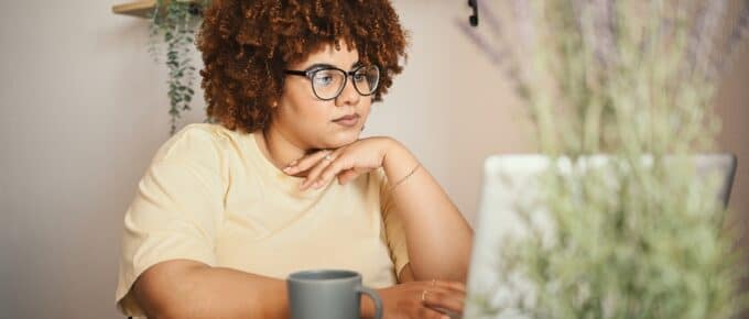 African American Woman Looking at her Laptop