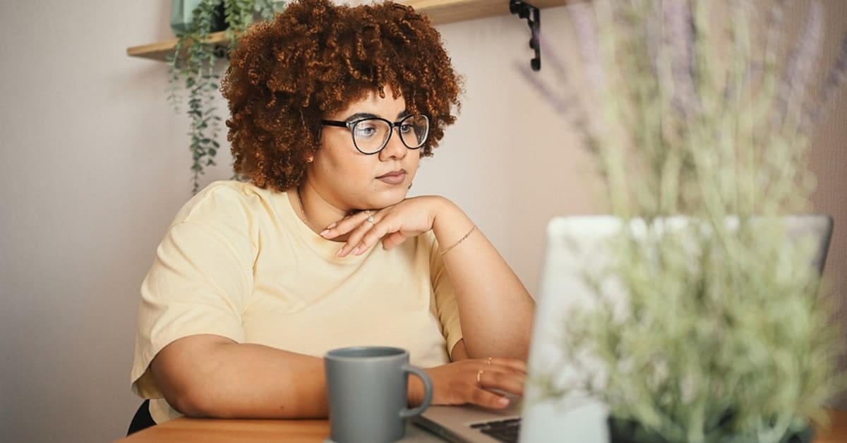 African American Woman Looking at her Laptop