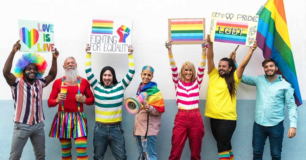 People Posing with Signs Holding LGBTQ Equality Signs