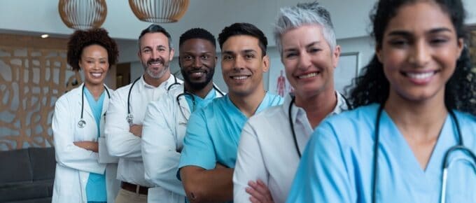 Line of Physicians Smiling Posing for Camera