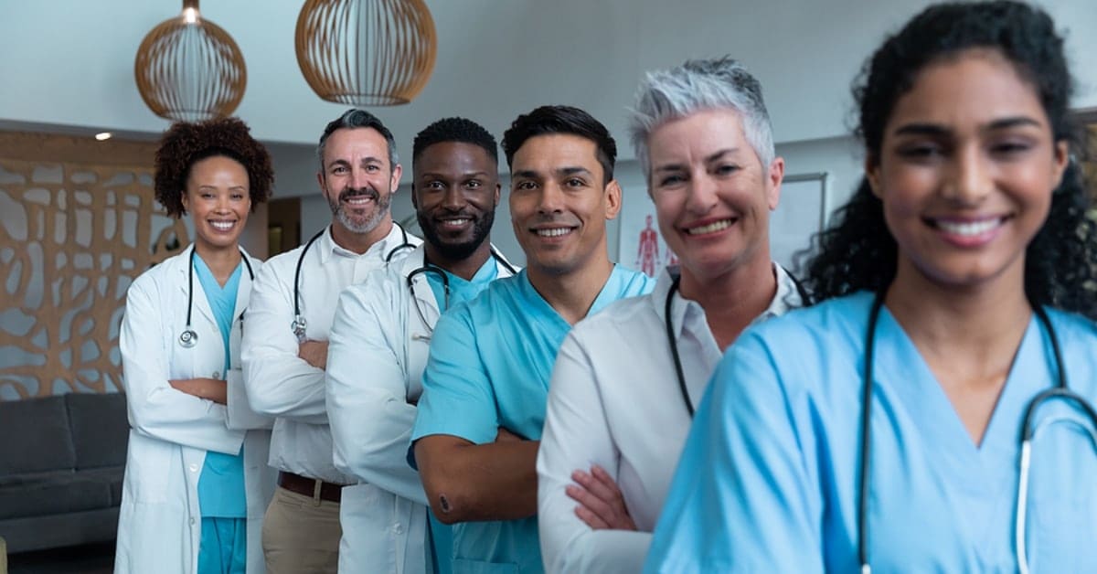 Line of Physicians Smiling Posing for Camera