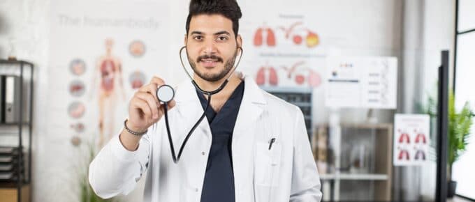 Male Physician in White Coat Posing