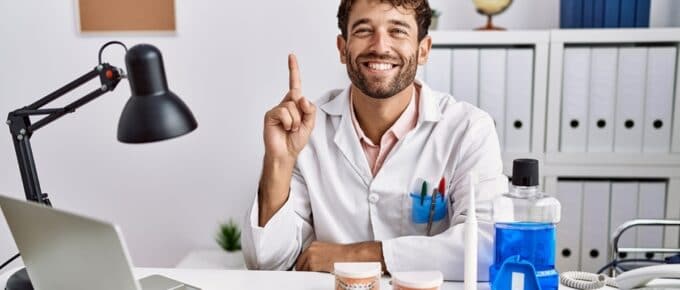 Man Posing Holding Number One Finger Up Smiling