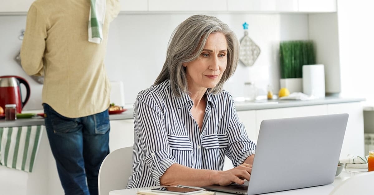 Middle-Aged Woman on her Laptop at Home