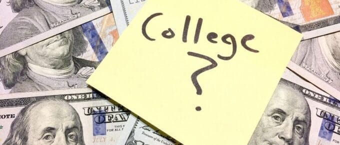 Post-It with College? Written on it Stuck on top of One-Hundred Dollar Bills