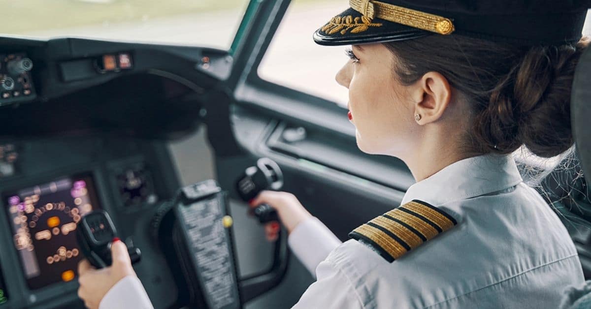 Female Pilot Steering a Plane
