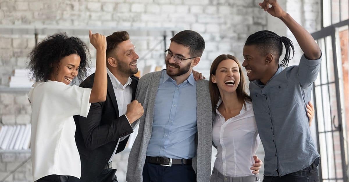 Five People Celebrating and Happy in a Loft