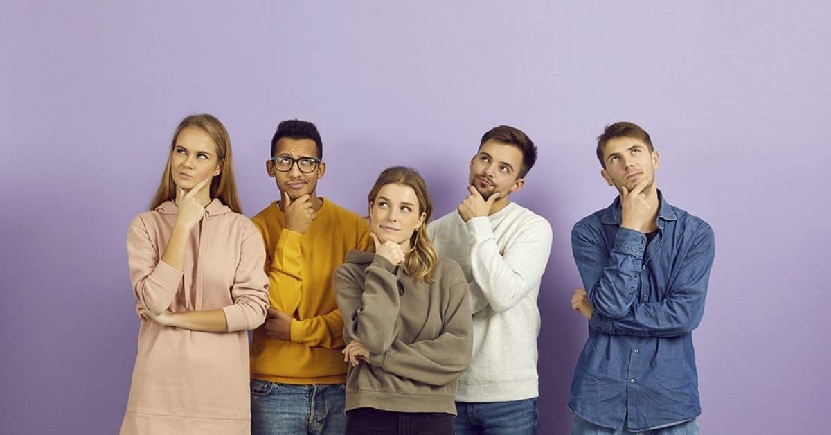 Diverse group of puzzled people thinking about problem or doubting their decisions