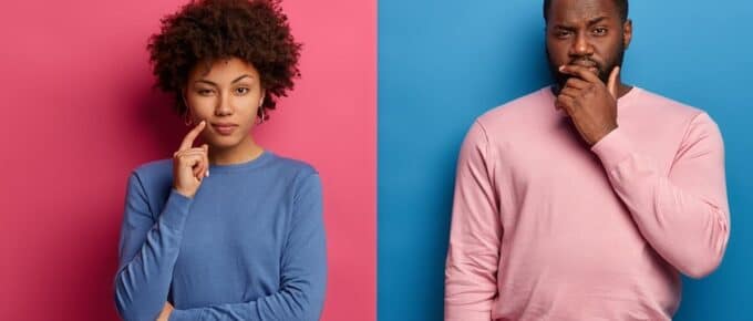 Serious dark skinned female and male have deep thoughts