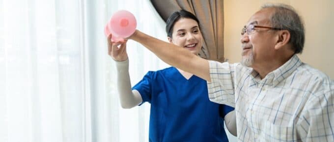 Asian young woman nurse at home nursing care support disabled senior elderly man