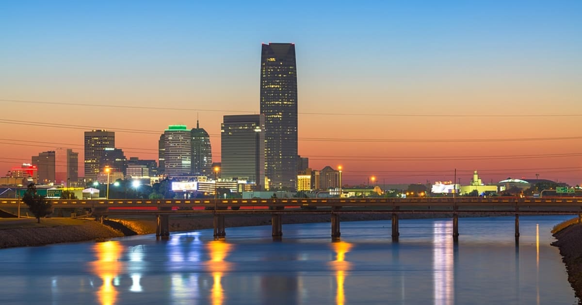 Oklahoma, USA downtown skyline on the Oklahoma River at dusk.