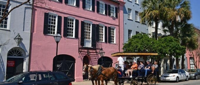 Tourists take advantage of the horse drawn carriages to view and learn about the history of Charleston.
