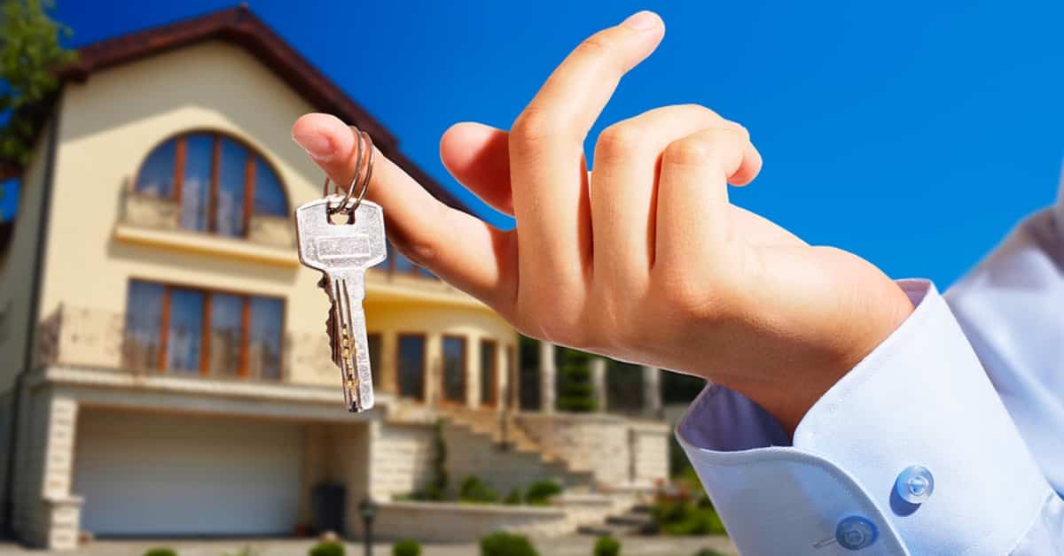 House owner/real estate agent giving away the keys