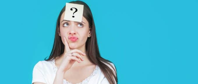 Thinking woman with question mark above her head.