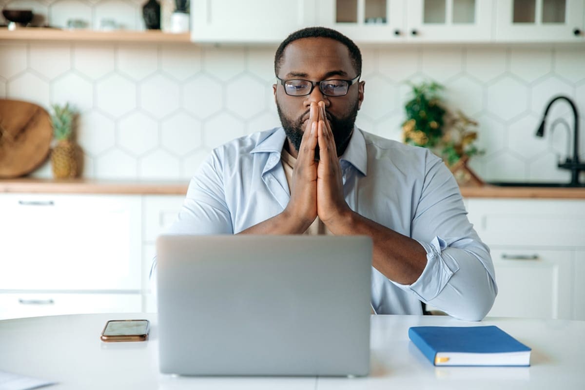 Concentrated business african american man working from home, with laptop, thinking