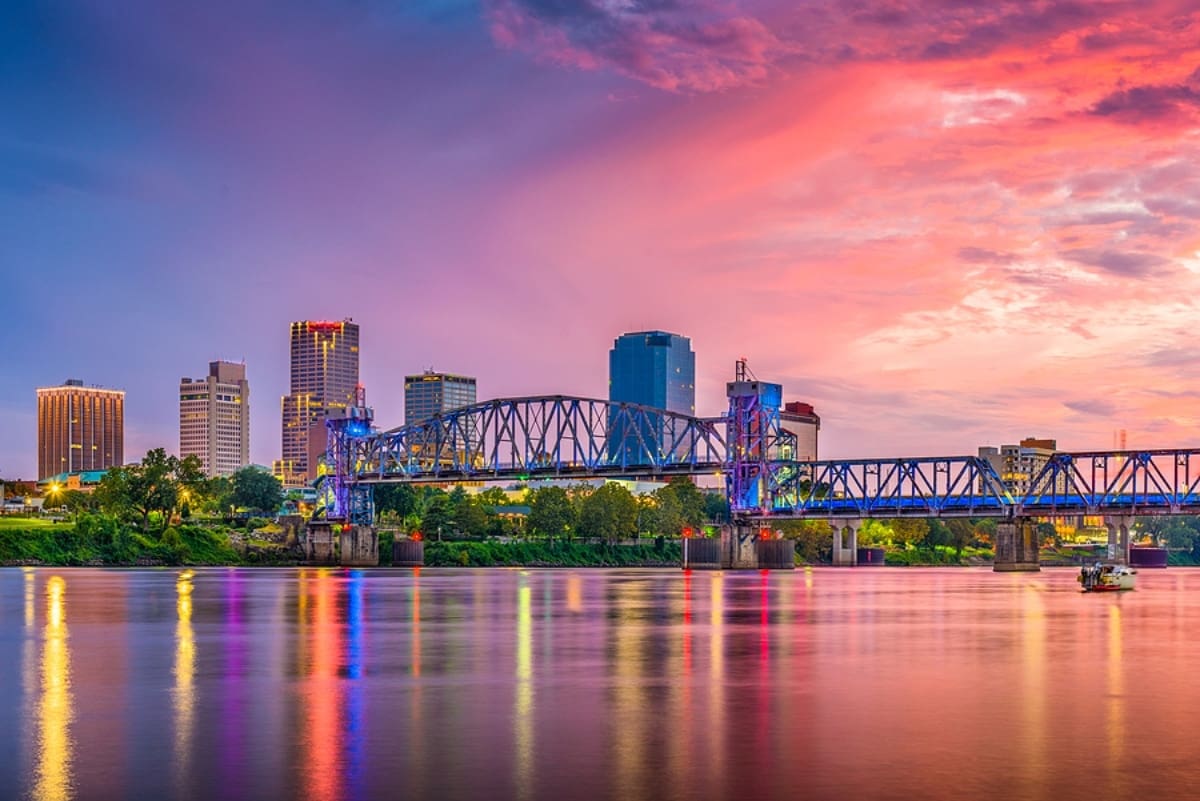 Little Rock, Arkansas, USA skyline on the Arkansas River at dusk.