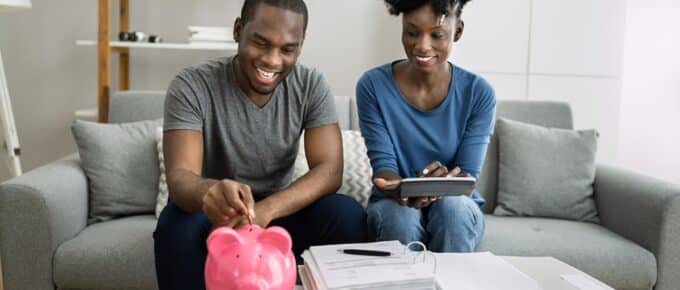 Happy African Couple Doing Retire Finances Plan And Money Budget