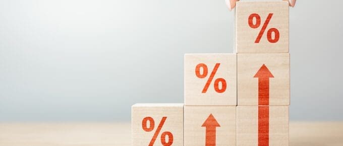 Wooden blocks with percentage sign and arrow up