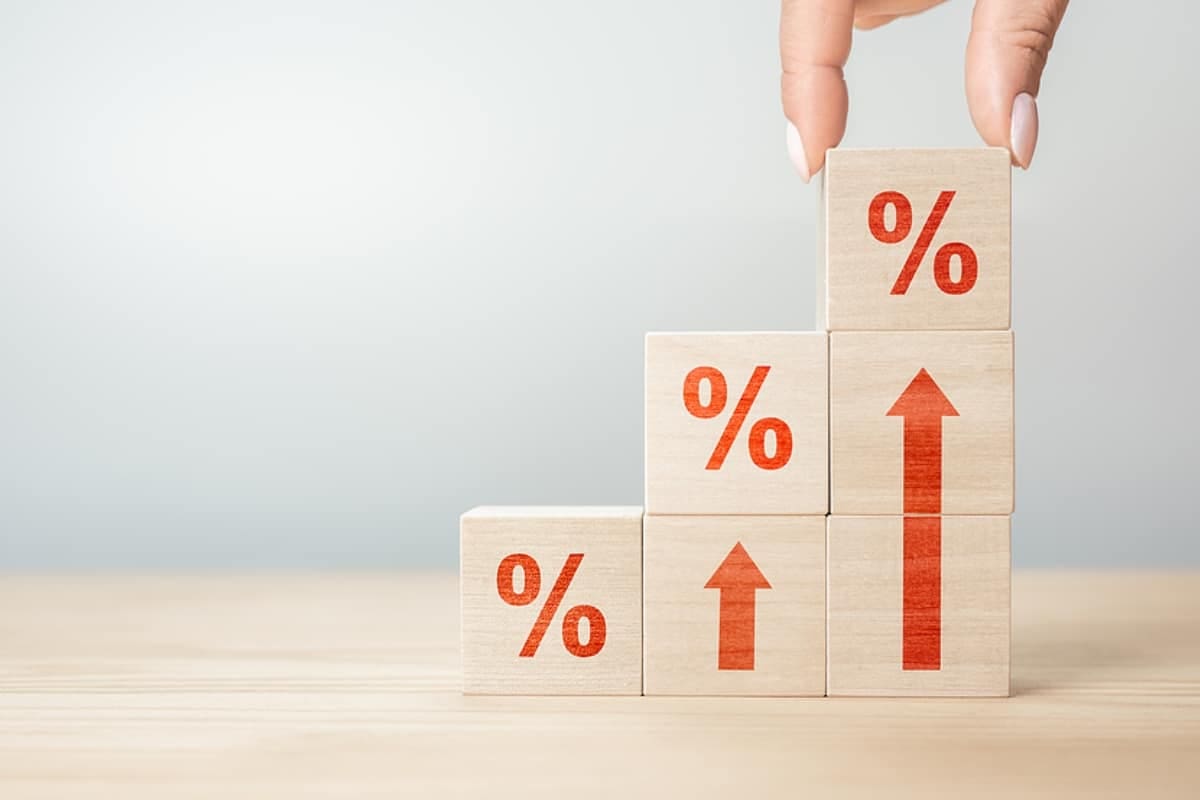 Wooden blocks with percentage sign and arrow up