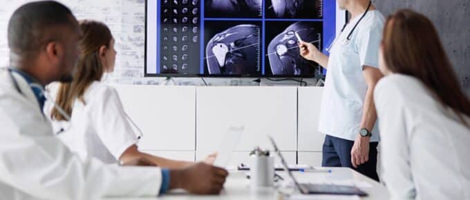 pain management physicians looking at mri scan results