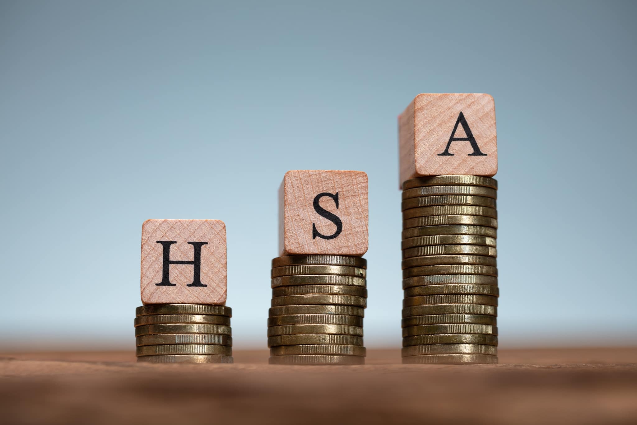 HSA Health Savings Account Wooden Blocks On Coin Stacks