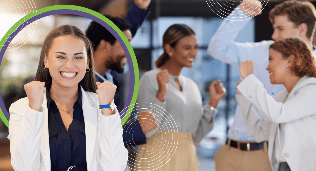 one female office worker cheering very happy, with other office workers also looking very happy in background