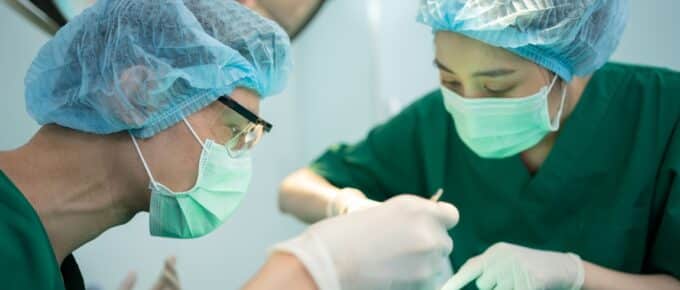 Asian Professional surgeons team performing surgery in the operating room