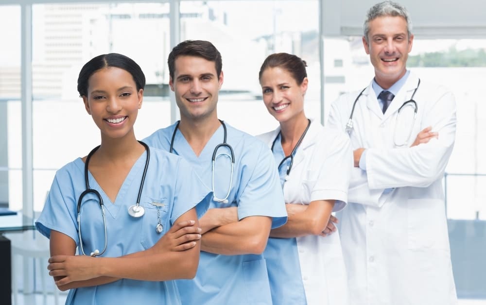 Portrait of confident doctors in row at medical office