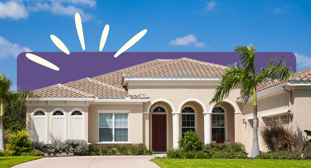 house in Florida, palm trees and clear sky in background