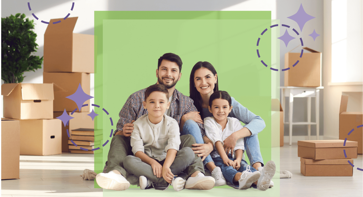 A young family with two small kids sitting around empty cardboard boxes