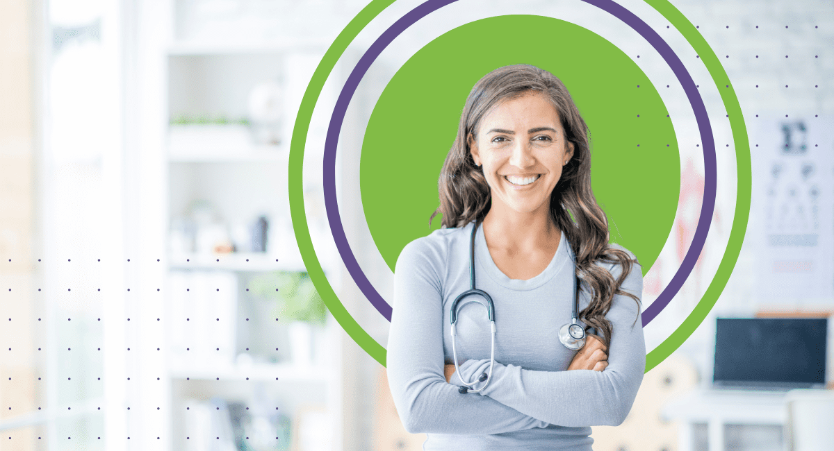 female physician smiling, standing proudly with arms crossed