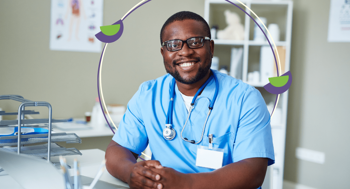 male physician smiling in office, wearing stethoscope