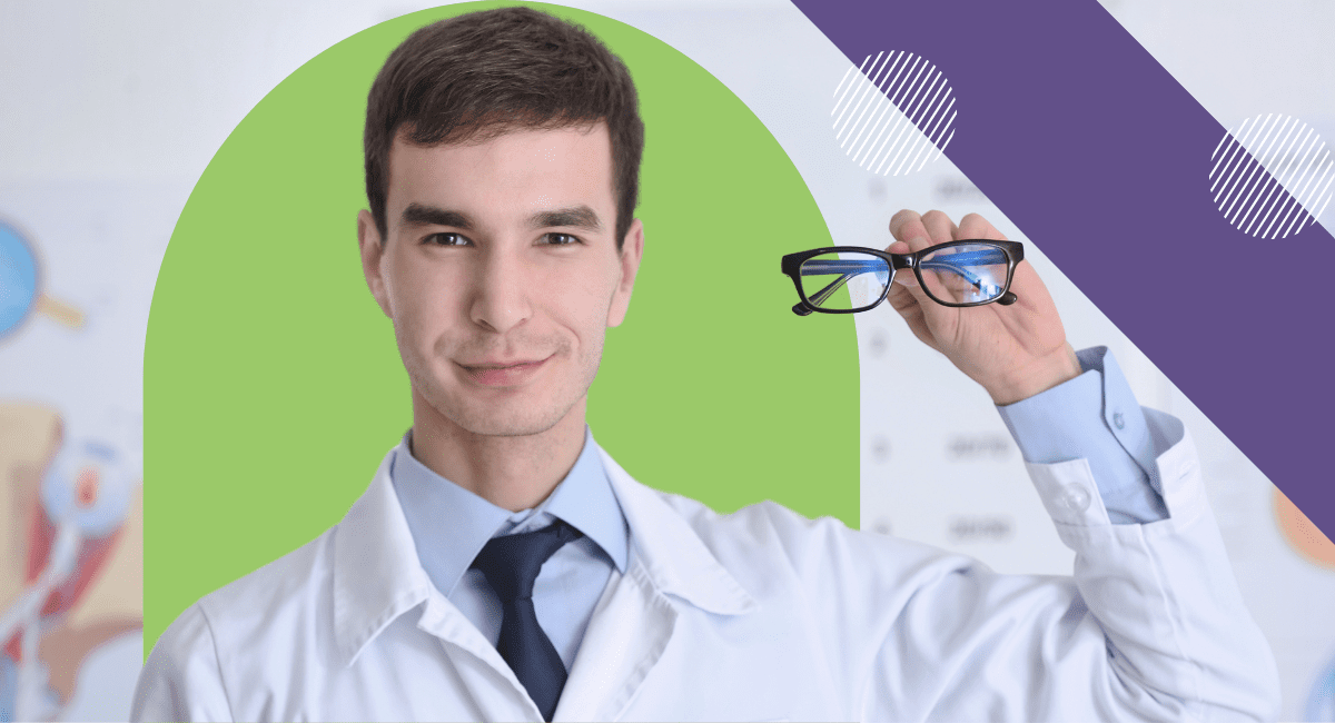 A young man in a white coat holding up a pair of eye glasses