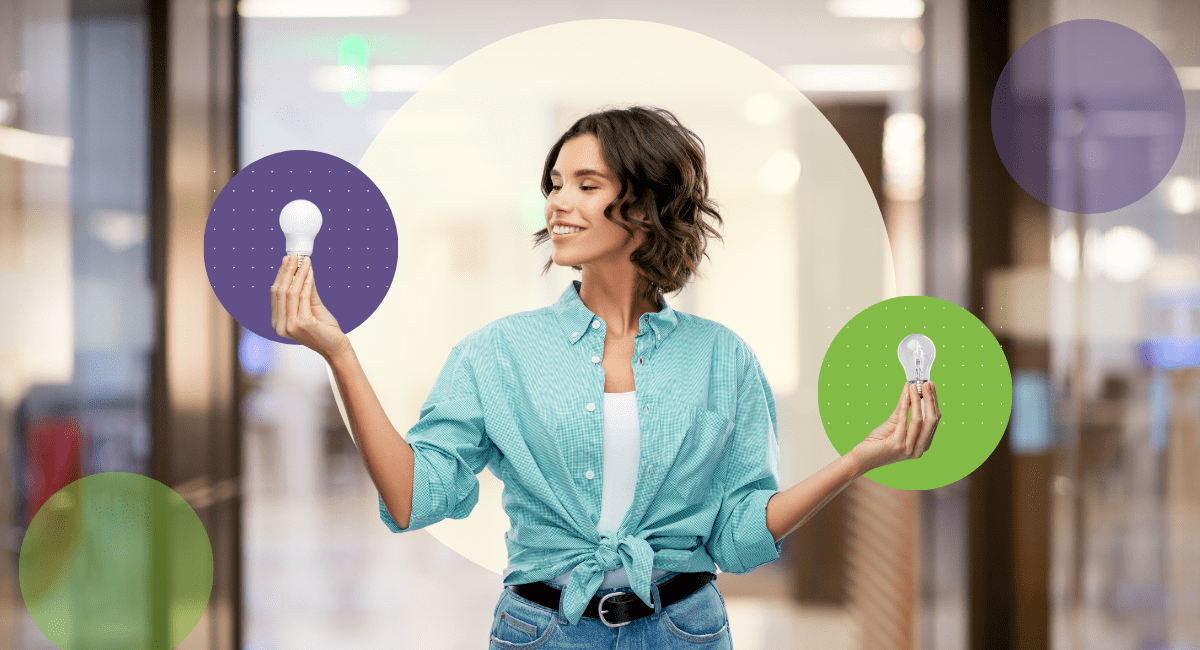 female holding two lightbulbs comparing both