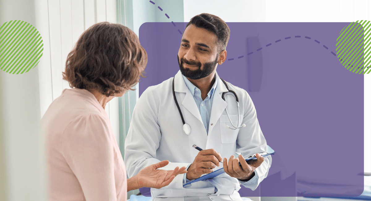 male physician talking with a patient, writing on his clipboard