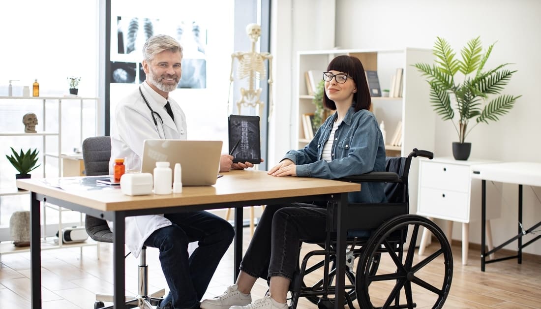 Doctor and meeting with a woman with disability