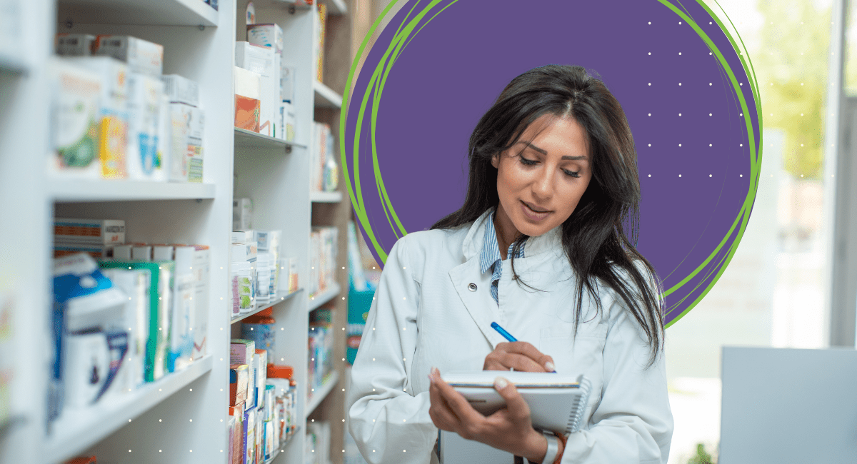 pharmacist with long brown hair, writing on her notebook next to a shelf with medication bottles