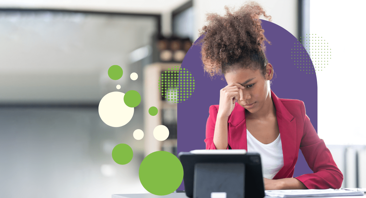 female with dark curly hair looking concerned in office