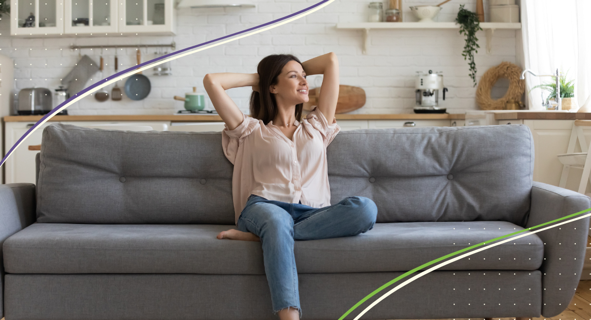 young female sitting on sofa looking very relaxed