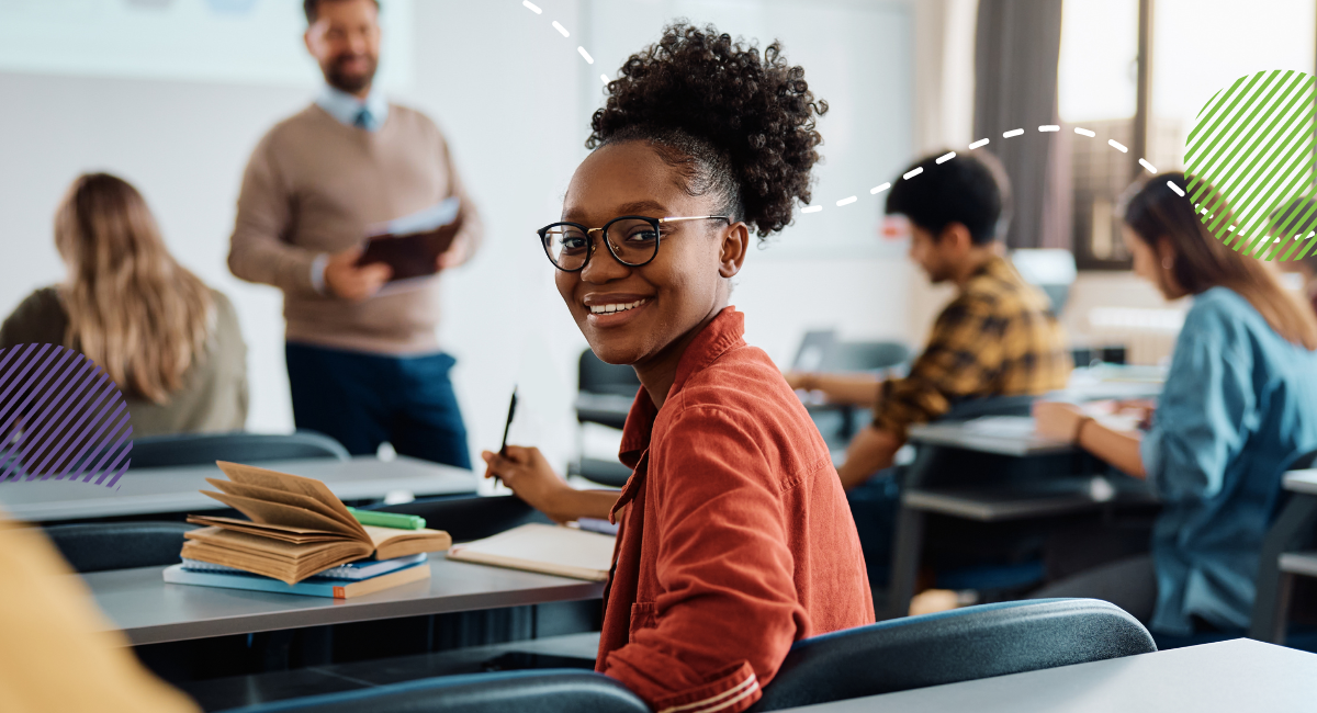 young female student looking at camera in classroom setting