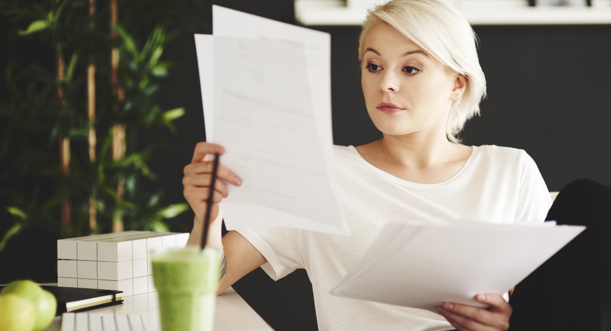 Businesswoman comparing documents in an office
